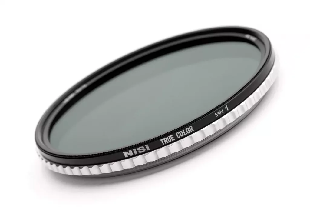 A NiSi True Color ND-VARIO filter on a white background, showing the TRUE COLOR and MIN 1 markings on the knurled frame