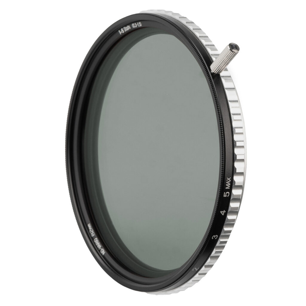 A NiSi True Color ND-VARIO filter on a white background with the silver rotation handle fitted to the front ring