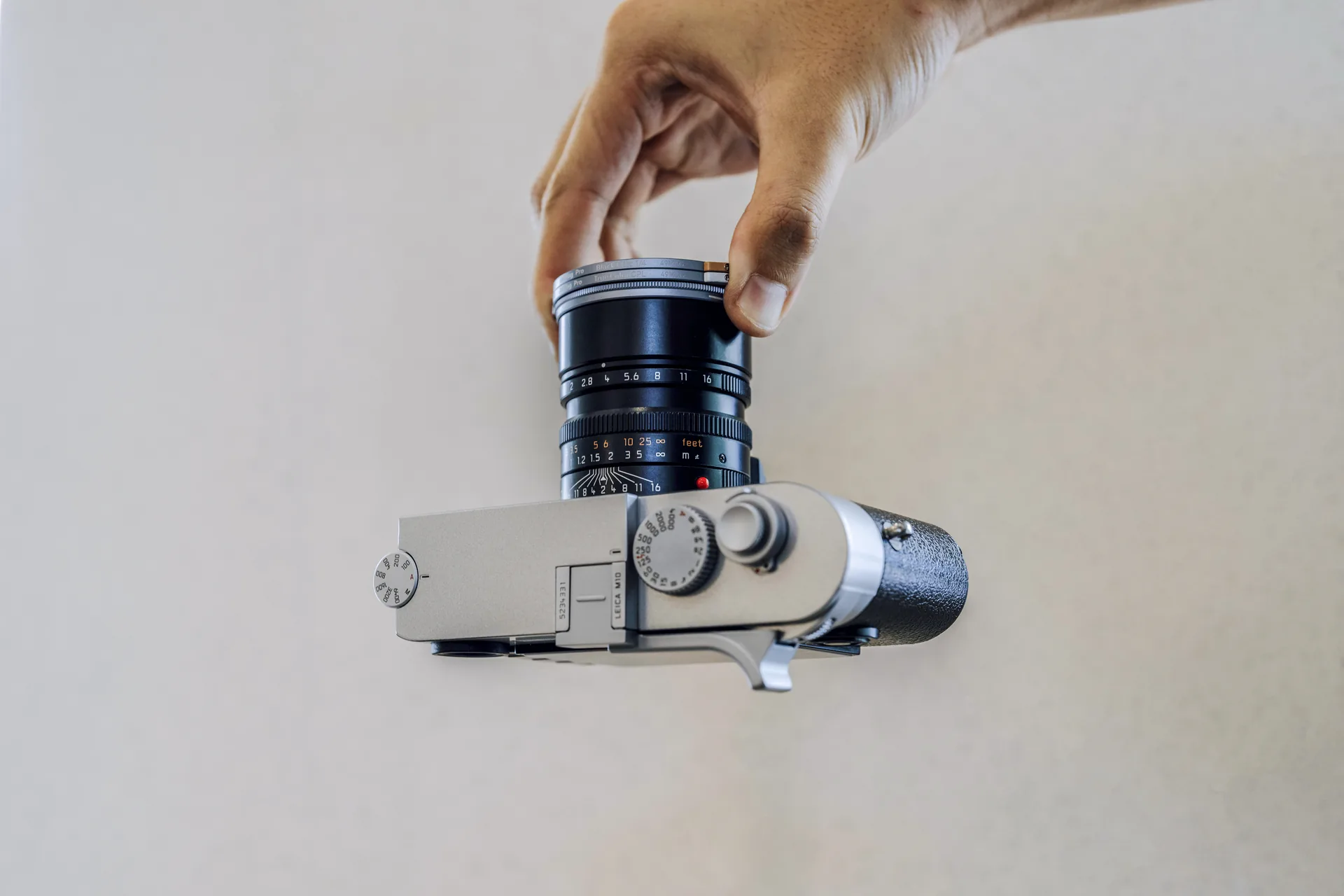 Twisting a 49MAG filter to lock it on a Leica lens