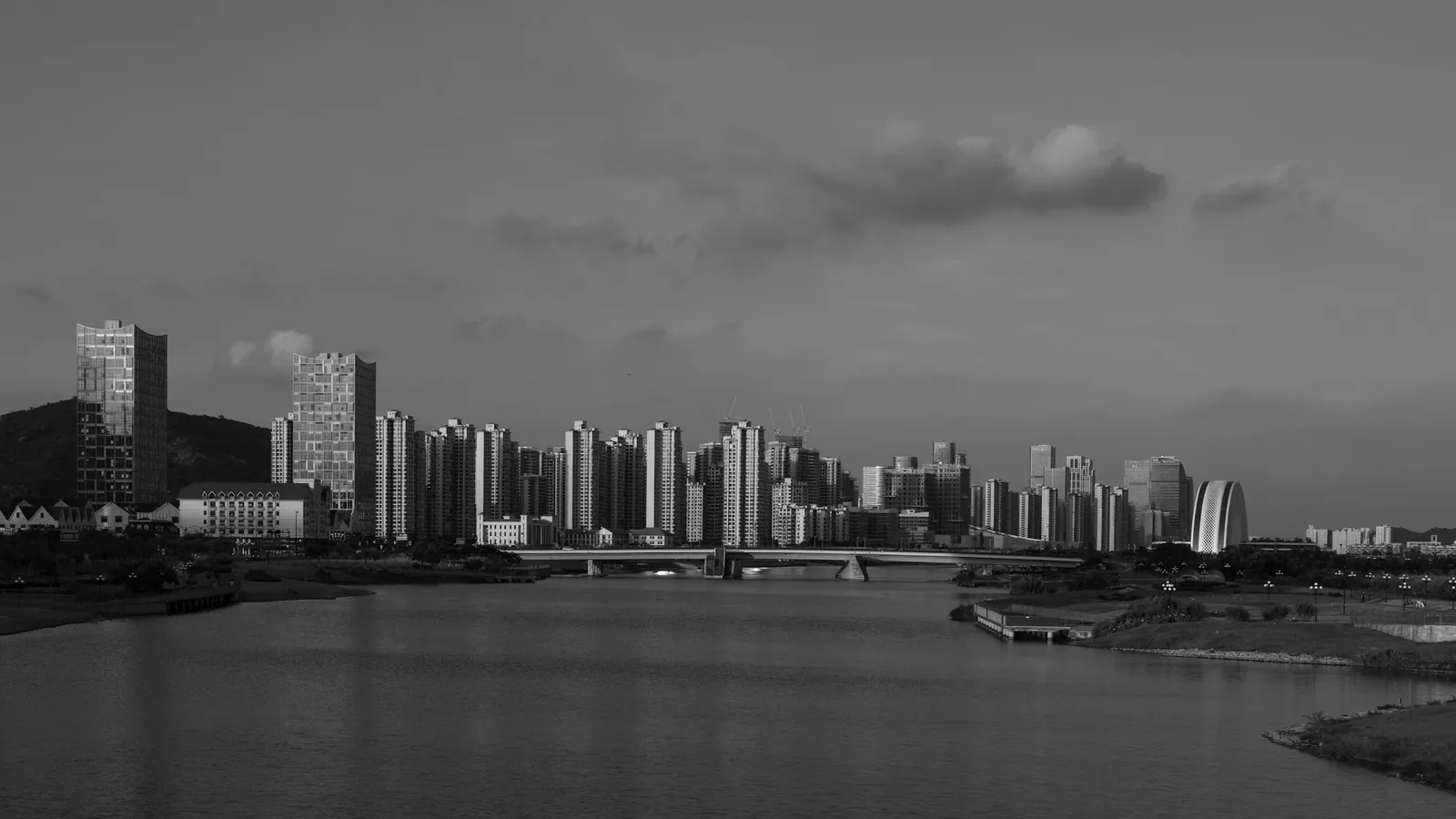 The same skyline with an orange filter, darkening the sky further