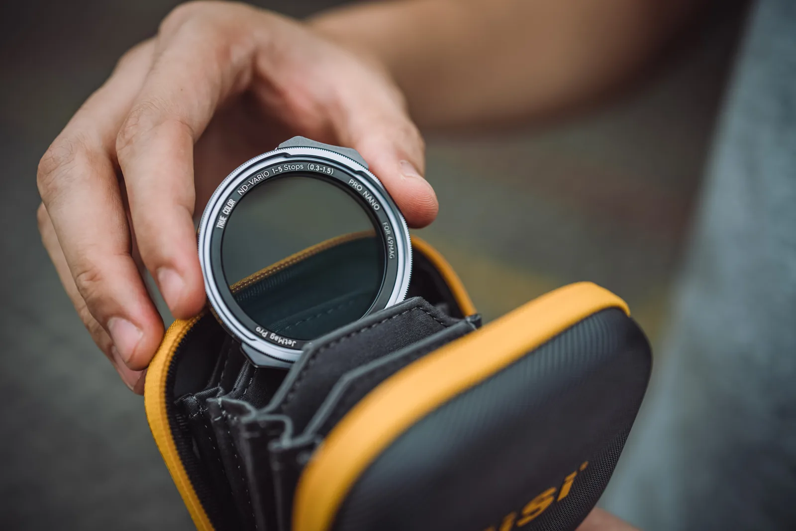 A NiSi JetMag Pro 49MAG filter going into the NiSi caddy pouch