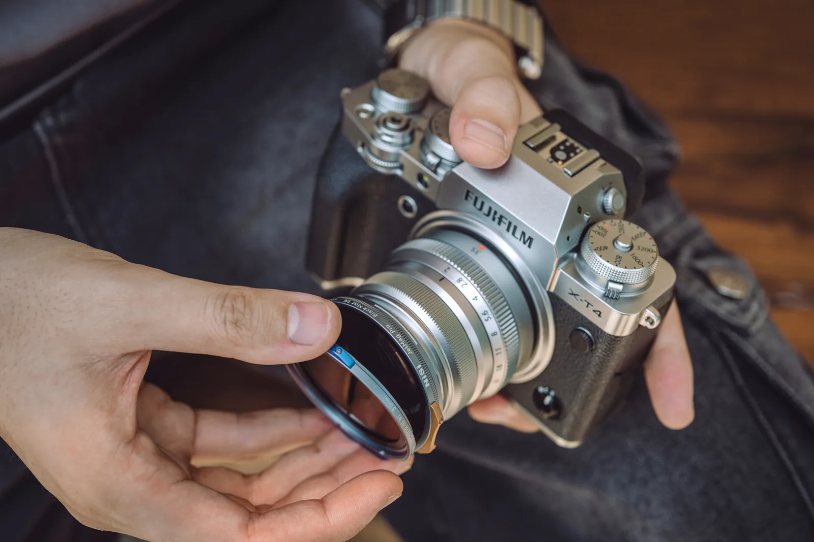 Offering a NiSi JetMag Pro 49MAG adaptor ring up to a Fujifilm X-T4 lens