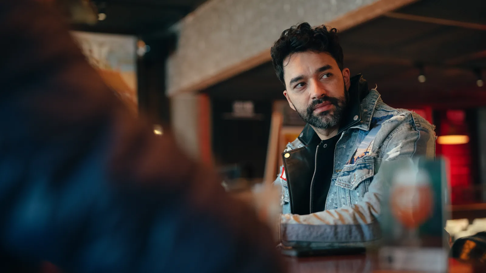 A portrait in a bar photographed on the Athena 35mm at T1.9