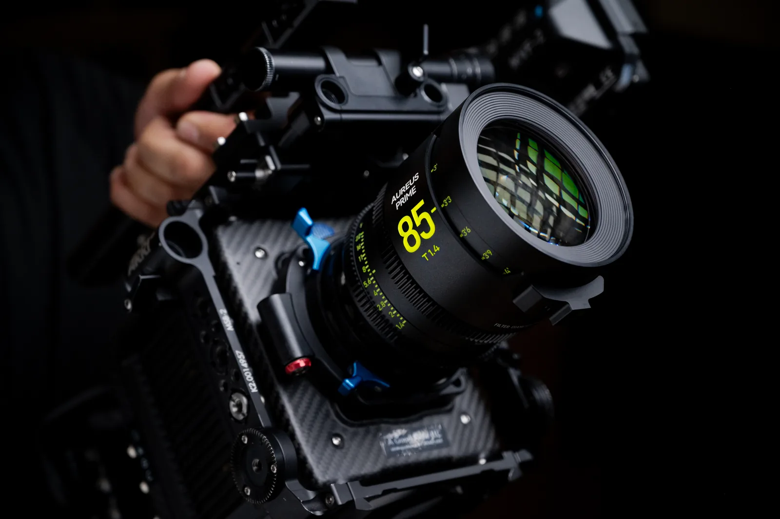 An AUREUS PRIME 85mm lens with a follow focus on a cinema camera rig