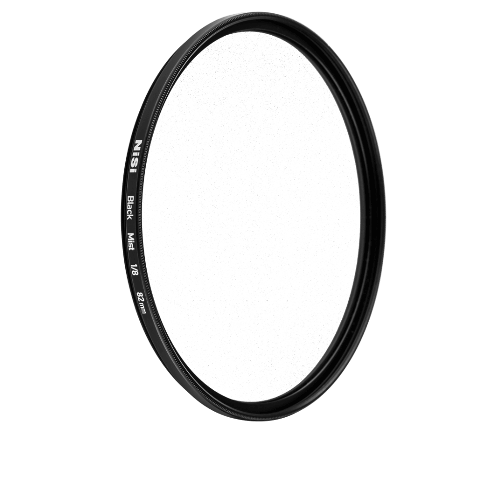 A NiSi Black Mist 1/8 filter on black, showing the fine black particle pattern in the glass